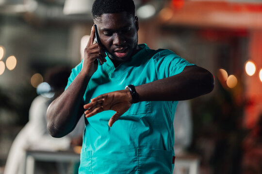 Healthcare worker urgency checking time during phone call