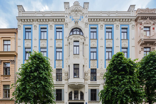 Albert Street, apartment buildings along the street designed by the architect Mikhail Eisenstein, a building facade with decorative stonework and blue painted panels. 