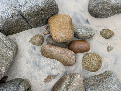 Granite Rocks on the Beach, smoothed by water and sand erosion. 