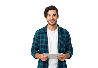 Smiling young man with dark hair wearing a plaid shirt and white t shirt holds a tablet computer against a black background