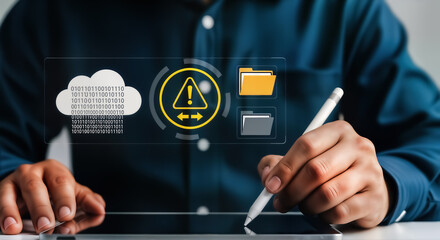 A person is using a tablet with a stylus, interacting with a digital interface displaying cloud storage, a warning sign, and file folders, symbolizing data management and security