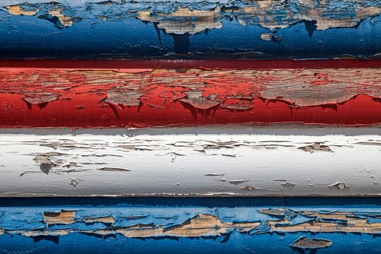 Peeling Red, White, and Blue Paint on Wooden Wall