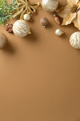Elegant Christmas decoration border on a minimal beige vertical background. Copy space.