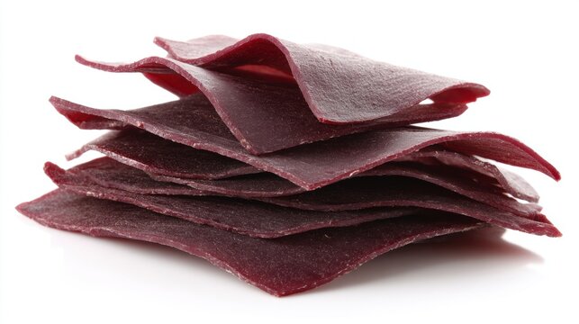 Stack of thin, dark red beef jerky sheets on white background. Minimal, clean food presentation highlighting texture and color. High-protein dried meat snack for healthy eating