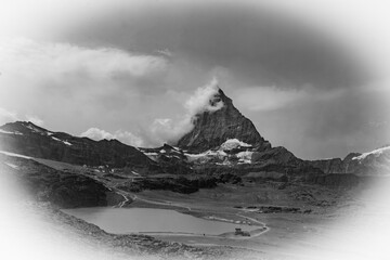 Matterhorn seen from the Glacial Paradise cable car in Zermatt, with the Swiss Alps stretching into the background under a clear alpine sky.