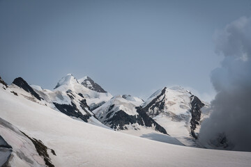 Snow-covered Mt. Breithorn on border of Italy and Switzerland on a clear alpine day, showcasing dramatic peaks, glaciers and panoramic views of the Swiss Alps