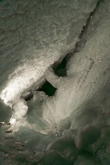 Ice tunnel inside the Matterhorn Glacier Paradise, Zermatt, showcasing deep blue glacial ice and shimmering alpine interiors.