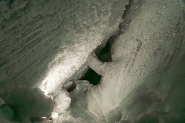 Ice tunnel inside the Matterhorn Glacier Paradise, Zermatt, showcasing deep blue glacial ice and shimmering alpine interiors.