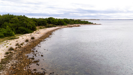 Remote Croatian Beaches Accessible Only by Off-Road Vehicles. Rugged coastline, untouched nature, wild Mediterranean landscapes and secluded turquoise shores captured from above