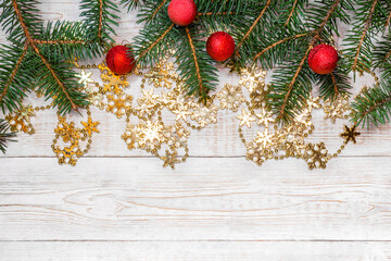 Christmas background - fir branches over white wooden table