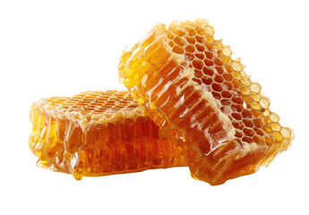 Two pieces of honeycombs, golden-brown, with dripping honey