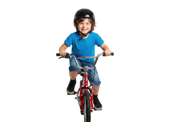 Joyful young boy wearing a helmet rides a red bicycle with a big smile against a stark black background