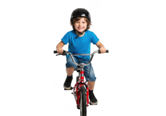 Joyful young boy wearing a helmet rides a red bicycle with a big smile against a stark black background