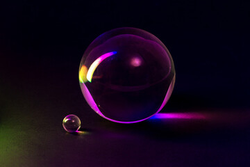 Close-Up of Glass Spheres in Vibrant Colorful Lighting