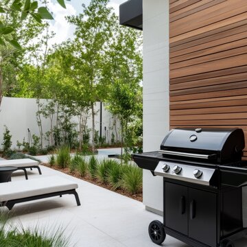 Modern Backyard BBQ Black Grill, Wood Wall and Loungers, Outdoor Living , Grill