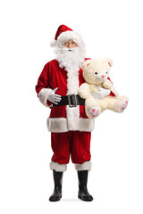 Santa Claus holding a big teddy bear