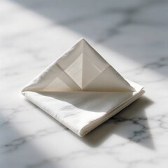 Sophisticated Neutral Table Setting: White Linen Napkin on Plate with Small Seashell Accent