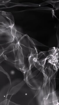 Smooth flowing translucent grey smoke forming soft drifting shapes on a dark background