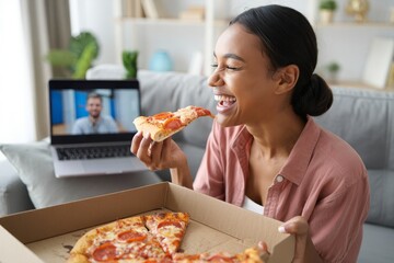 Young Woman Enjoying Pizza During Video Call - Remote Work & Lifestyle
