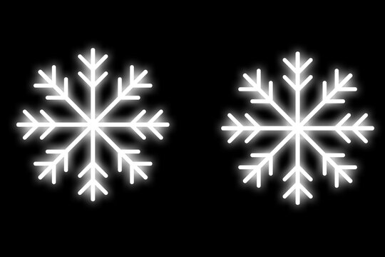 Two Glowing Snowflakes on Black Background for Winter Design