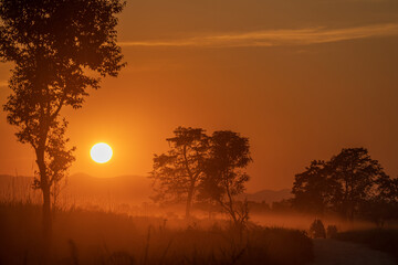 sunset in the mountains from Kaziranga National Park, India
