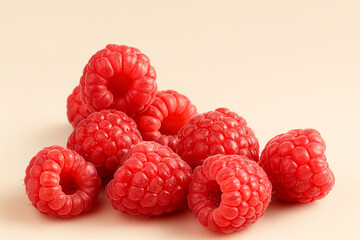 Fresh ripe raspberries isolated on a soft beige background with vibrant red color and juicy texture. Perfect for food ads, packaging, recipe design, healthy lifestyle branding, product labels and menu
