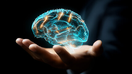 Business hand presenting a glowing digital brain hologram to illustrate artificial intelligence, data driven innovation and cognitive technology.
