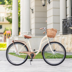 Fototapeta premium View of urban city bicycle parked on street in neighborhood. Sun bike summer. No people.