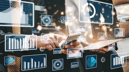 Businessmen engage with digital devices while analyzing financial data. Graphs and statistics overlay the scene, illustrating a focus on data-driven decisions and innovation. Xenic - Powered by Adobe