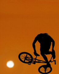 Fototapeta premium Bike acrobat at sunset in South Beach, Miami Beach, Florida, USA, 2020
