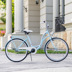 Fototapeta premium Side view of a modern city urban city bike or bicycle for street road. City bicycle parked on a lawn. Urban bike standing upright on grass, static, no people.