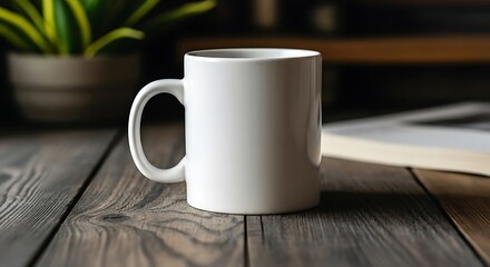 Tall white ceramic mug with handle on rustic wooden table next to open book and plant