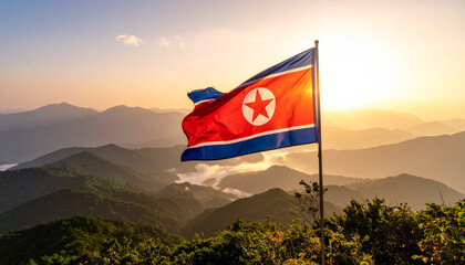 North Korea National Flag with Red Star Flying Over Mountain Sunset – Symbol of Sovereignty, Identity, and Cultural Pride Framed by Dramatic Sky, Rugged Terrain, and Patriotic Landscape in Golden 