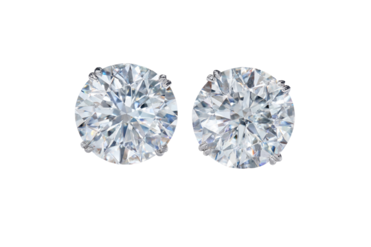 Close-up of two round brilliant-cut diamond stud earrings