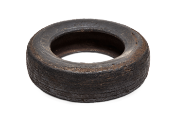 Old worn tire isolated on transparent background with visible wear and tear
