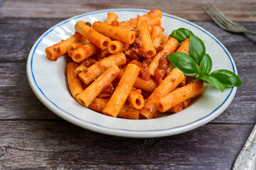  Pasta bolognese .Italian home made meal Fresh   maccheroni pasta with tomato sauce, basil, herbs ,parmesan cheese ,fresh cherry tomatoes and parsley on wooden background. Kitchen Poster 