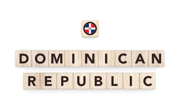 Wooden blocks bearing the name and flag of Dominican Republic. Dominican and Caribbean Culture, national identity, travel, and geography in a copy space design.