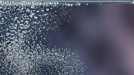 Bubbles Rising in Water: The image captures a dynamic scene of bubbles ascending through a clear liquid. The image exudes a sense of fluidity and visual interest. - Powered by Adobe