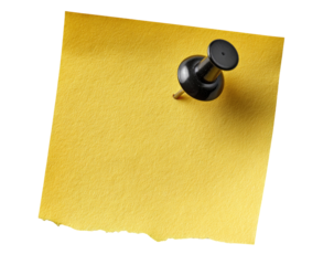 A close-up of a yellow sticky note with a black pushpin