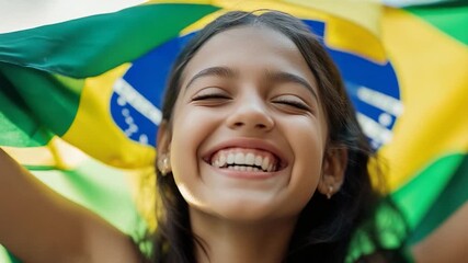 A young girl proudly holds a Brazilian flag, representing national pride and cultural heritage