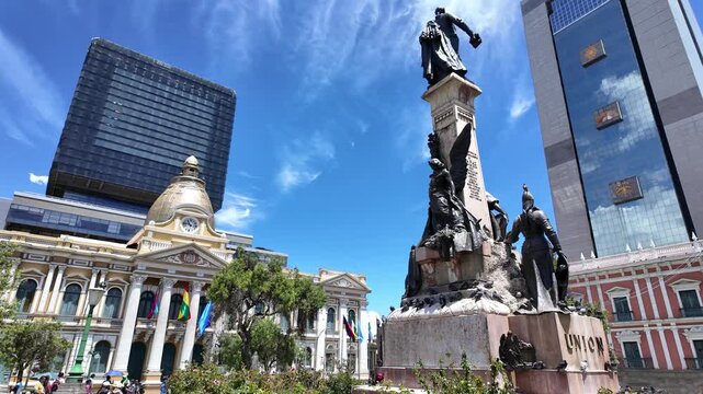 La Paz, Bolivia: La Paz Murillo square in Bolivia with the Legislative and government palaces , the bell tower and dome of the cathedral and office buildings on a sunny day