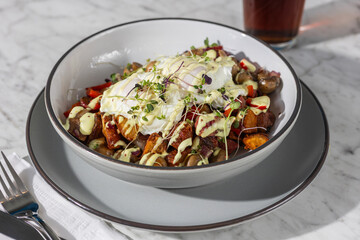 corned beef hash with eggs in hard light