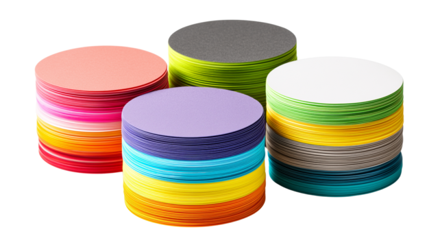 Colorful stacks of round paper on a pristine background, showcasing vibrant hues for creative design projects.