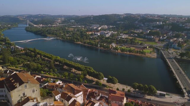 Drone aerial footage of Mondego River and old town of Coimbra, Portugal.