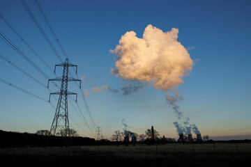 Cooling towers and high voltage pylons at biomass fuelled power station 