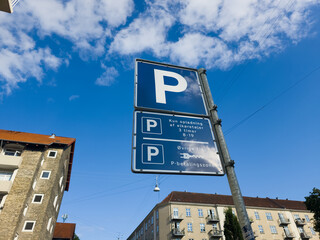 Copenhagen, Denmark - September 8, 2025: A sign showing rules for parking and charging for electric vehicles in Norrebro district
