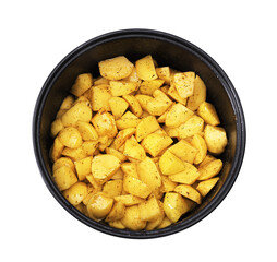 An overhead close-up of raw, diced yellow potatoes tossed with black pepper and spices inside the black pot of a multi-cooker.