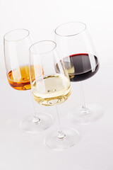 Naklejka premium Different wine glasses on white background
