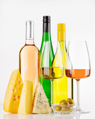 Naklejka premium Assorted cheeses and wine on white background