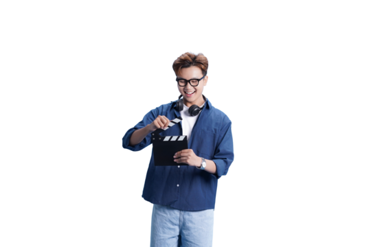 Young Filmmaker in Action: A smiling young filmmaker prepares for a shot. He is holding a clapperboard. the image perfectly captures the energy and focus behind the creation of a film.